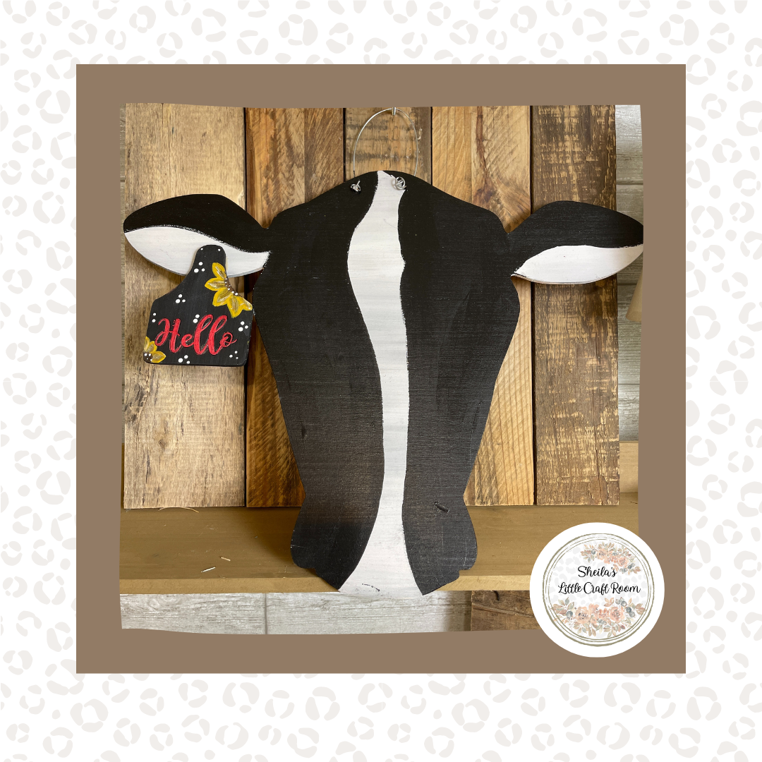 BLACK AND WHITE COW WITH HELLO AND SUNFLOWER TAG